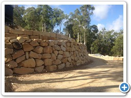 Carved and natural rock wall construction
